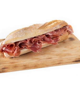 spanish serrano ham sandwich isolated on white background.